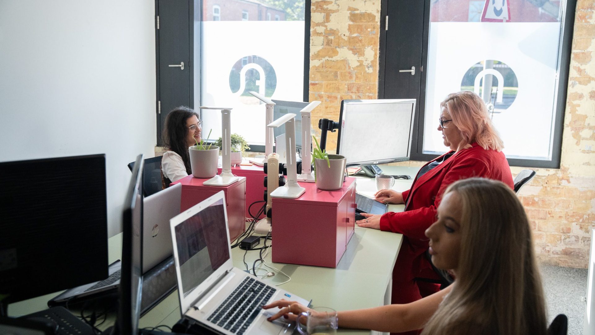 Celia and Esther at their desks. Celia and Esther at their desks.